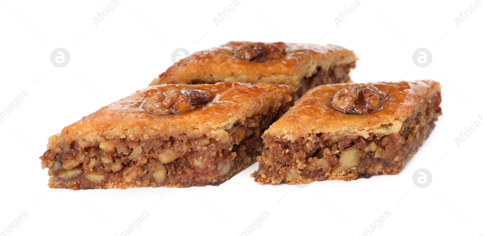 Photo of Delicious honey baklava with walnuts on white background