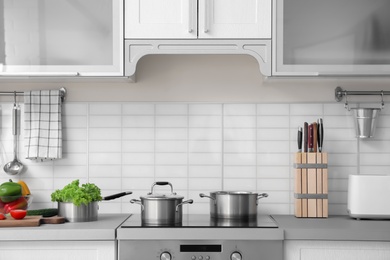 Photo of Modern kitchen interior with houseware and new furniture