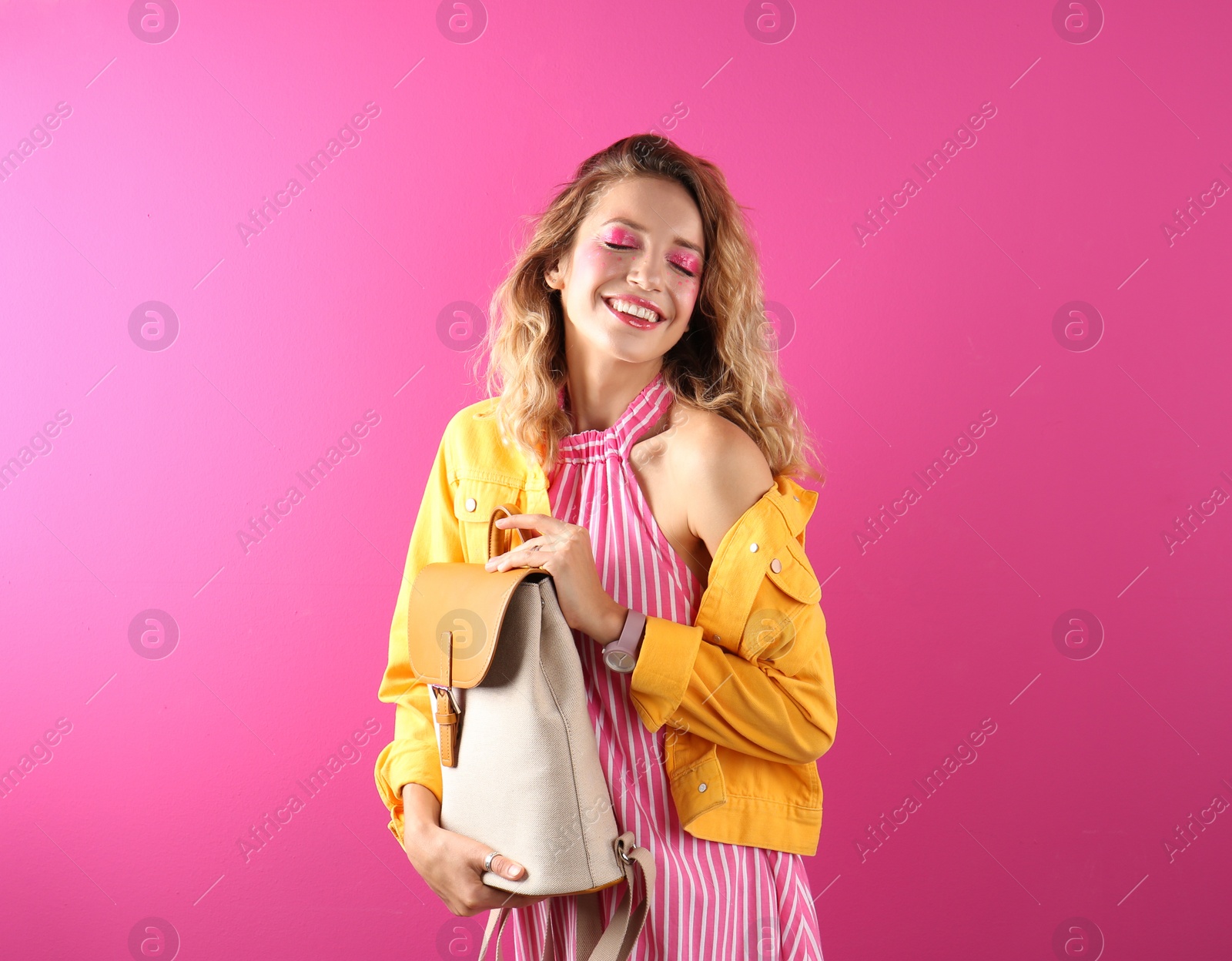 Photo of Beautiful young woman posing on color background. Summer fashion