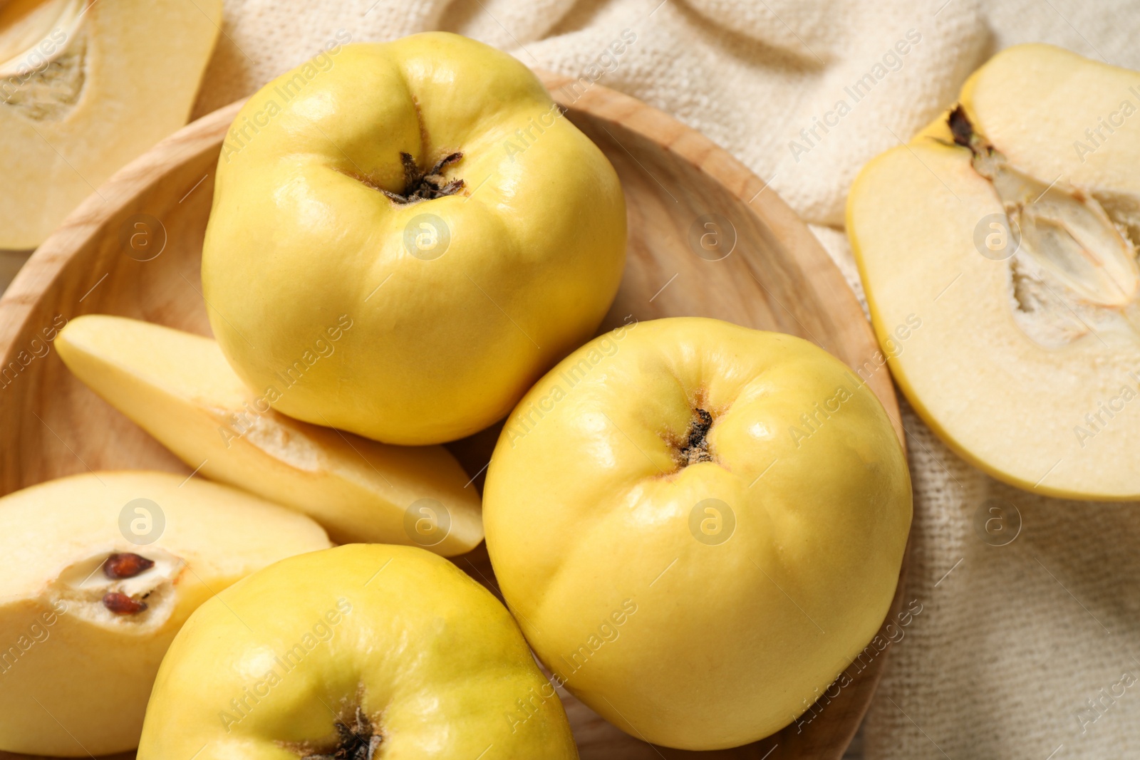 Photo of Fresh ripe organic quinces on table, flat lay