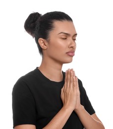 Photo of African American woman with clasped hands praying to God on white background