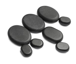 Photo of Group of black stones on white background
