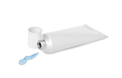 Photo of Open tube with ointment on white background