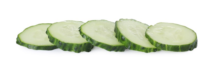 Photo of Many fresh cucumber slices on white background