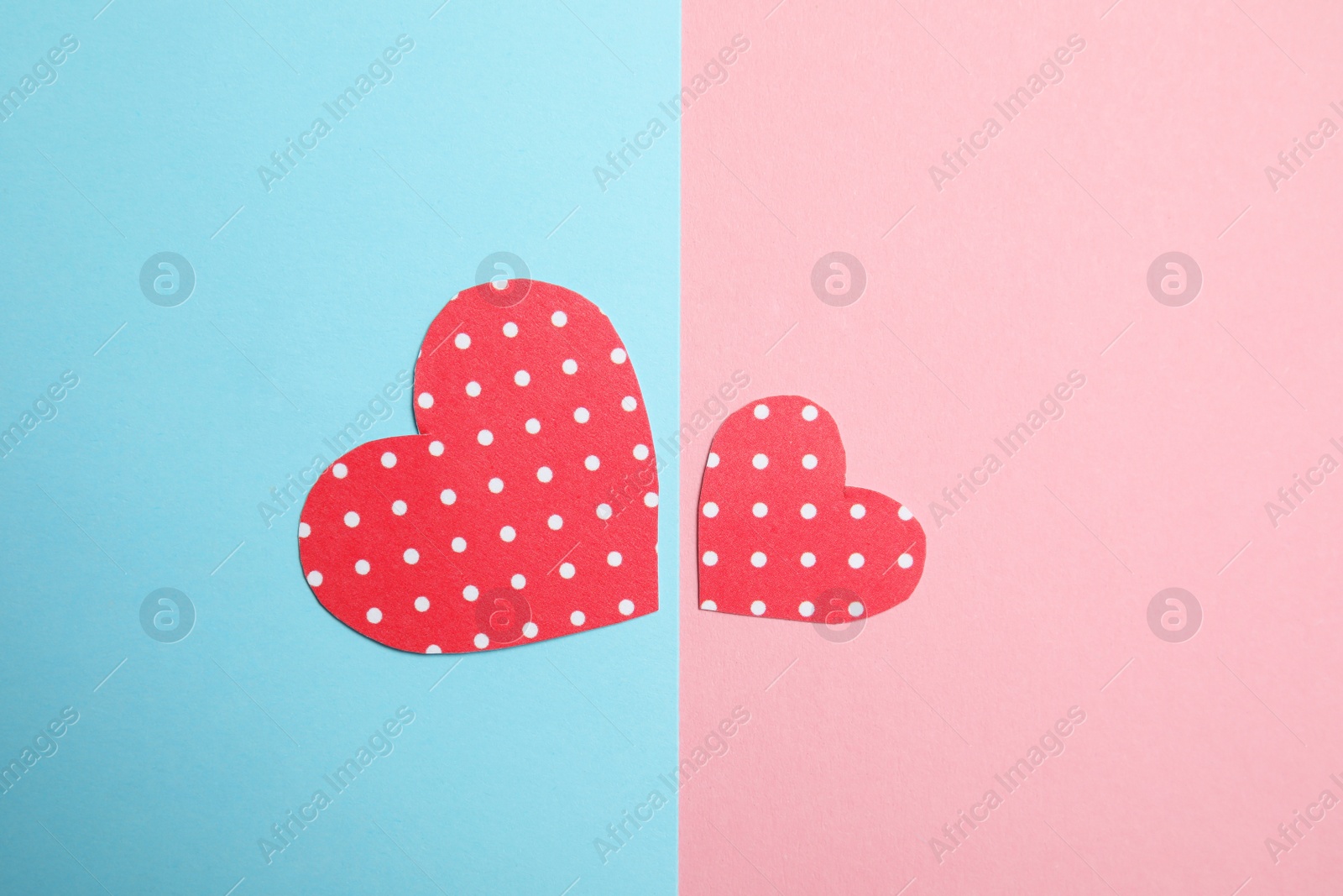 Photo of Small paper hearts on color background, top view