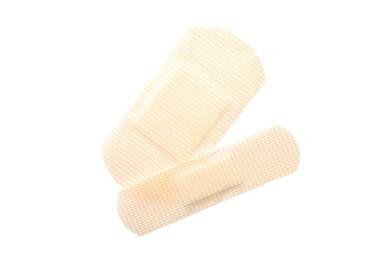 Photo of Medical sticking plasters isolated on white. First aid item