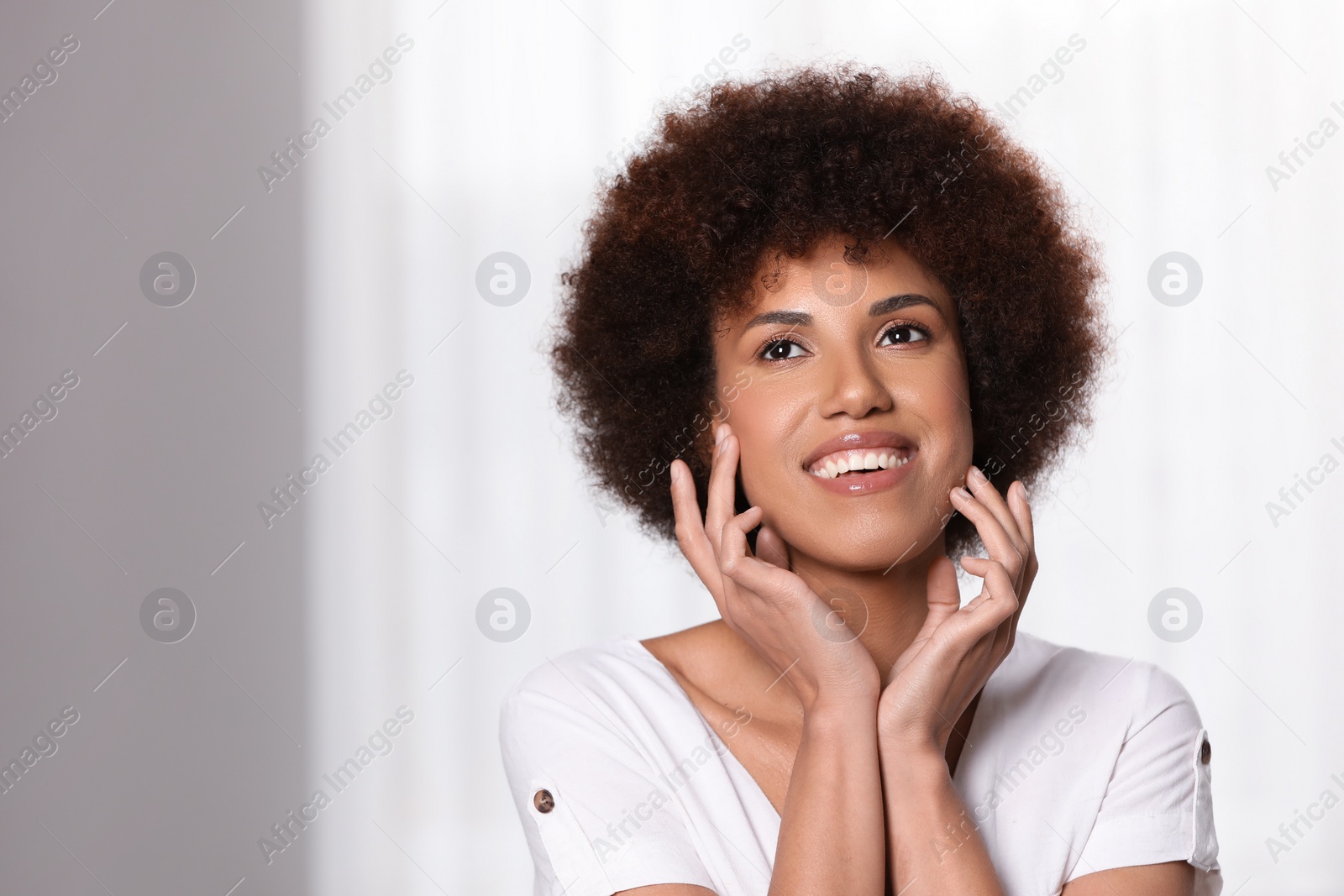 Photo of Portrait of beautiful young woman on light background. Space for text