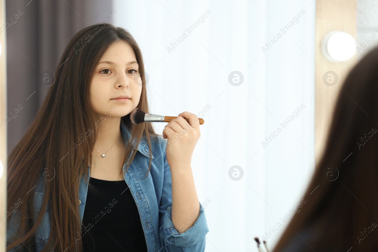 Photo of Attractive teenage girl in dressing room