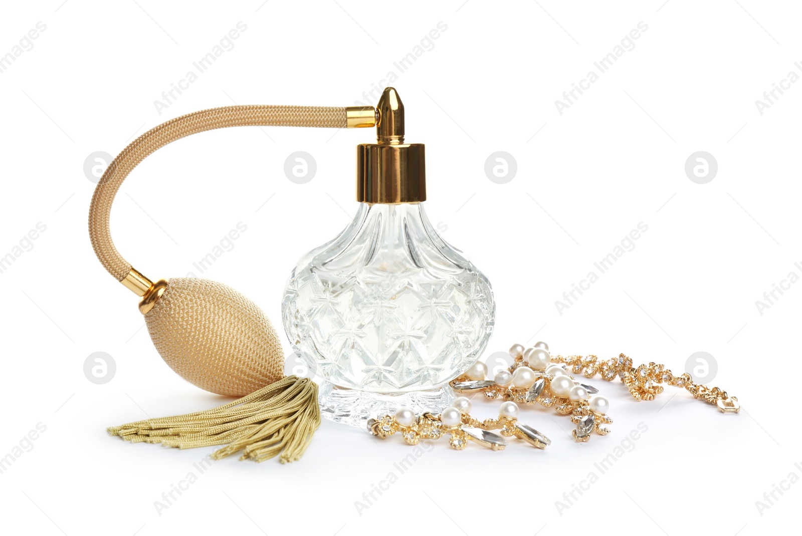 Photo of Glass bottle of perfume and luxury jewellery isolated on white