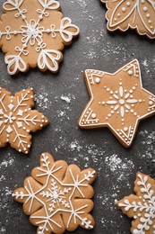 Photo of Tasty Christmas cookies on grey table, flat lay