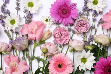 Photo of Flat lay composition with different beautiful flowers on white background