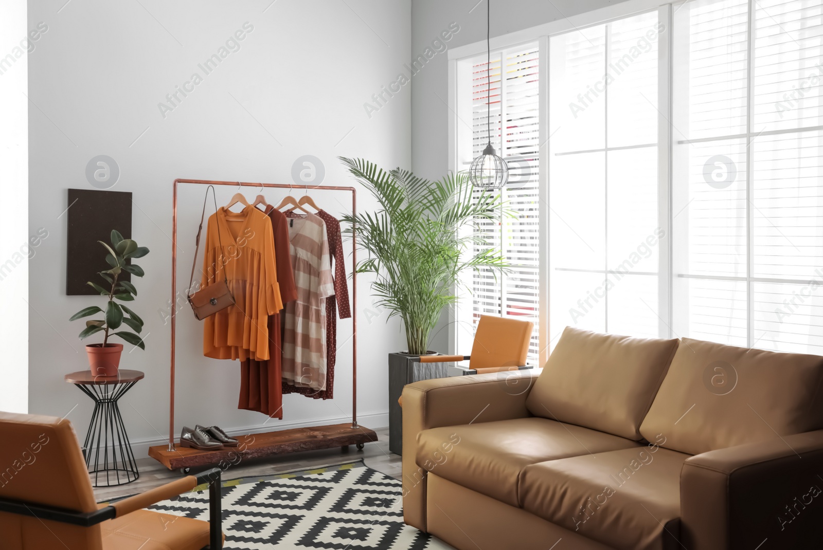 Modern living room interior with stylish leather sofa Photo of Modern living room interior with stylish leather sofa