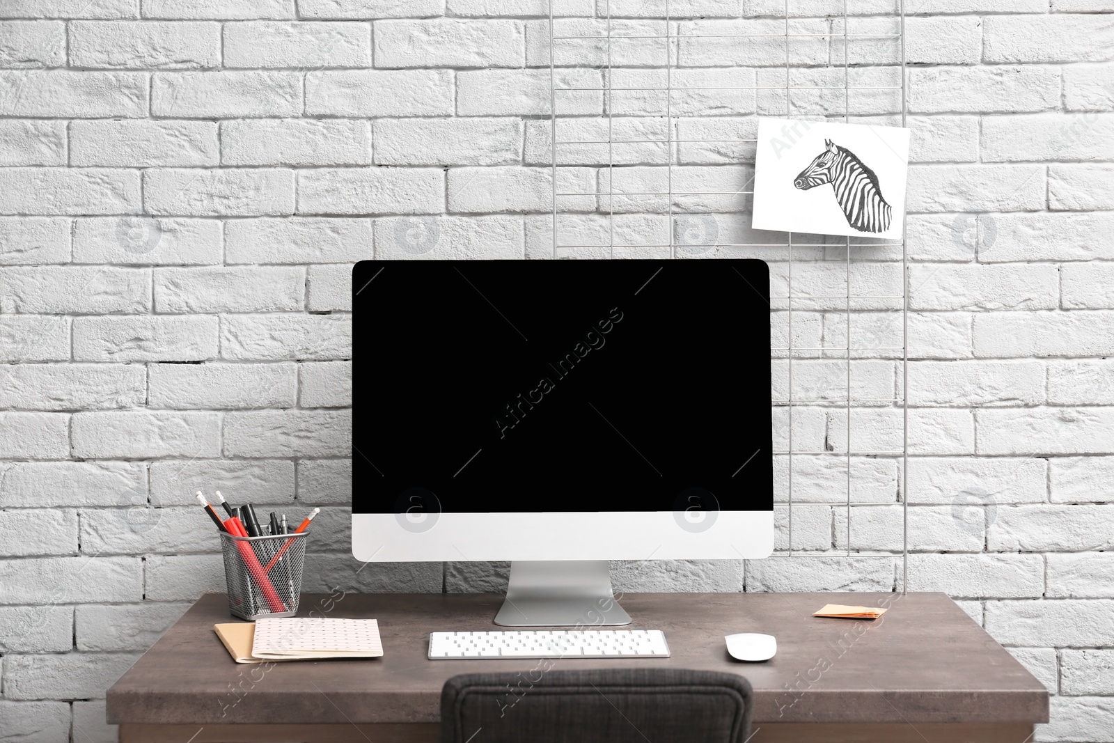 Photo of Comfortable workplace with computer on desk in home office