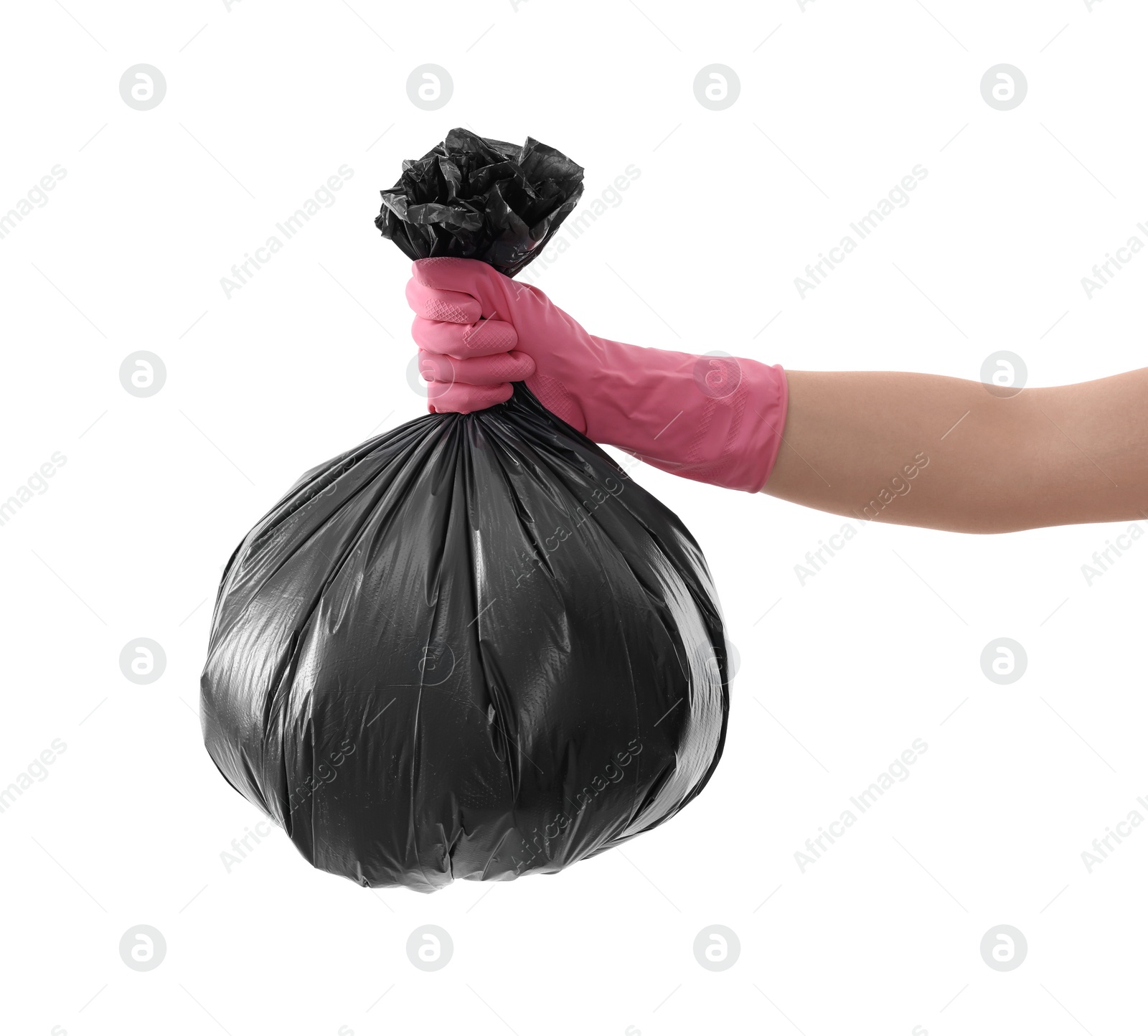 Photo of Woman holding plastic bag full of garbage on white background, closeup