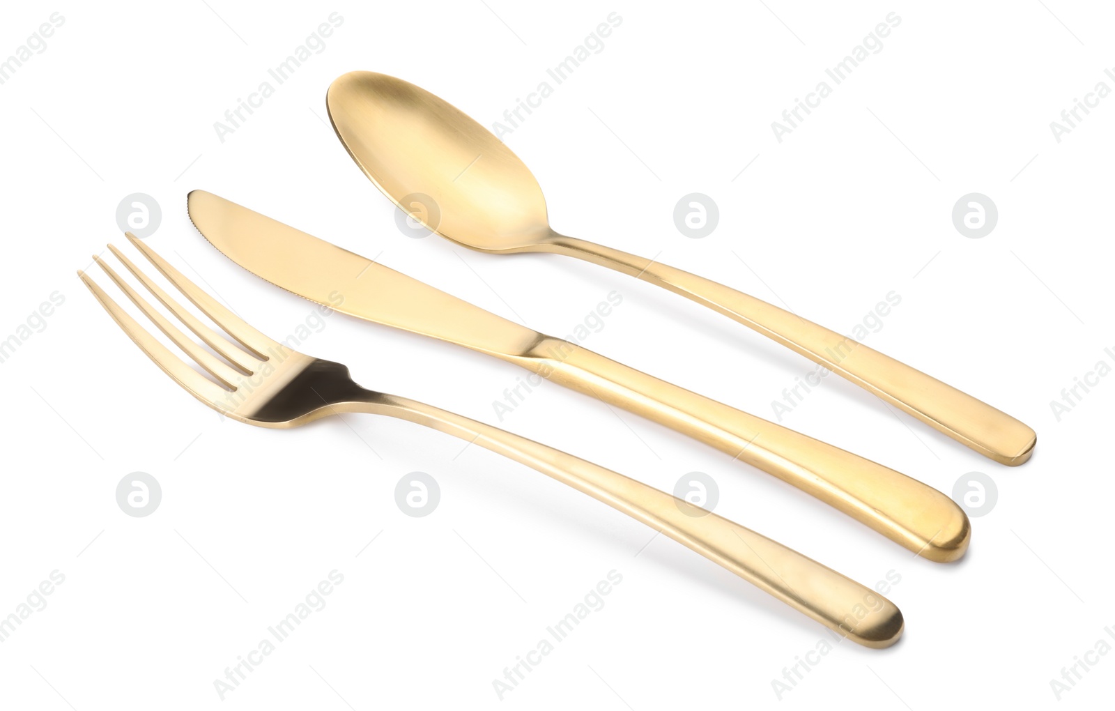 Photo of Shiny golden fork, knife and spoon isolated on white. Luxury cutlery set