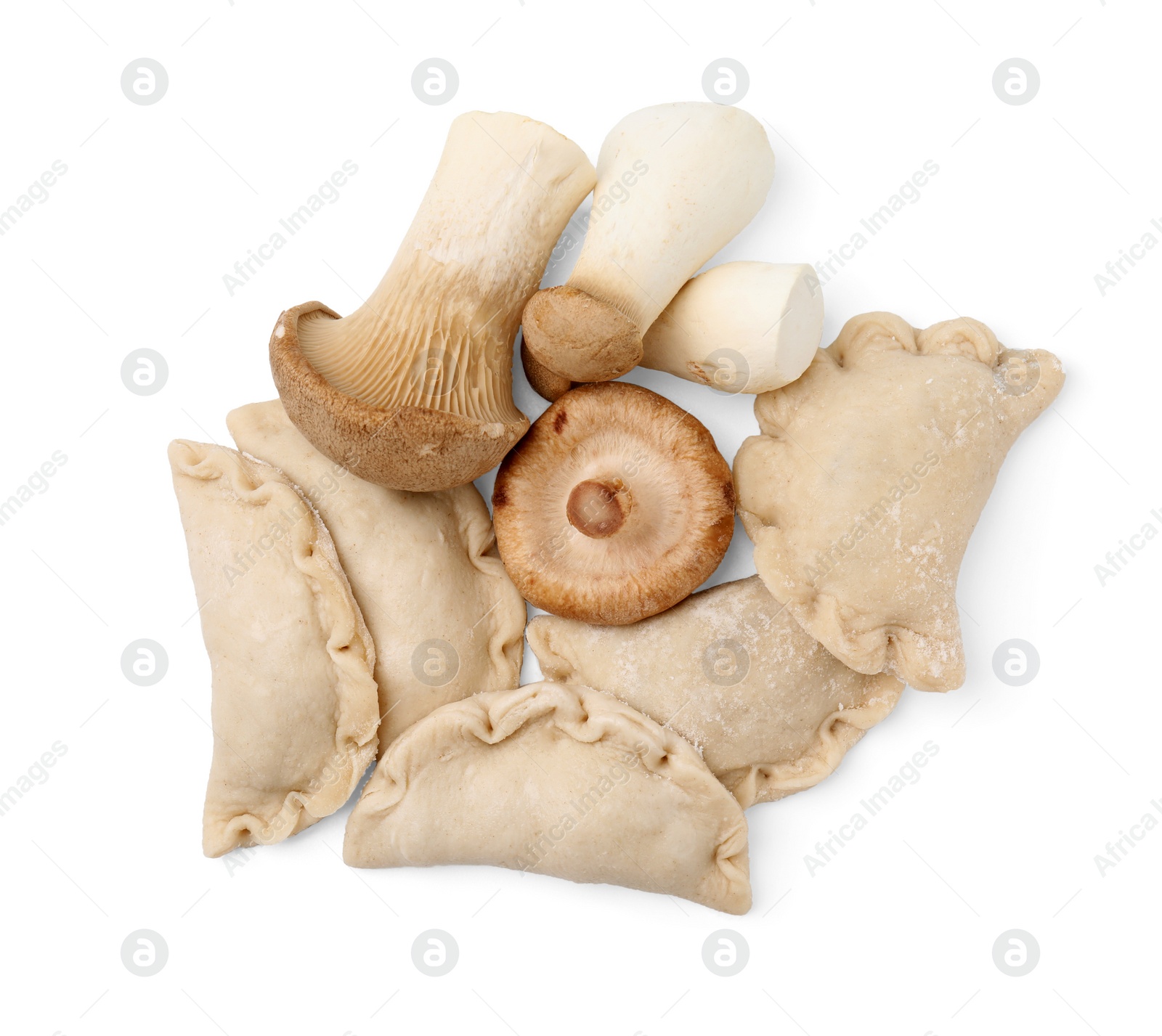 Photo of Raw dumplings (varenyky) and fresh mushrooms isolated on white, top view
