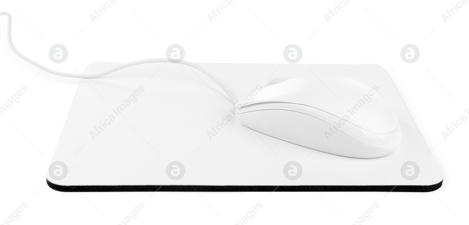 Photo of Modern wired optical mouse and pad isolated on white