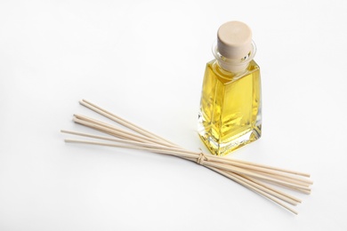 Photo of New reed air freshener on white background