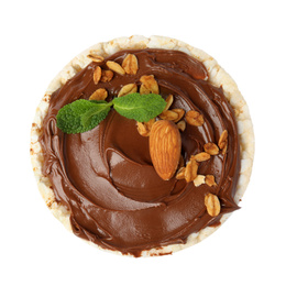 Photo of Puffed rice cake with chocolate spread, nuts and mint isolated on white, top view