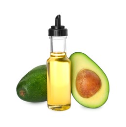 Cooking oil and fresh avocados isolated on white