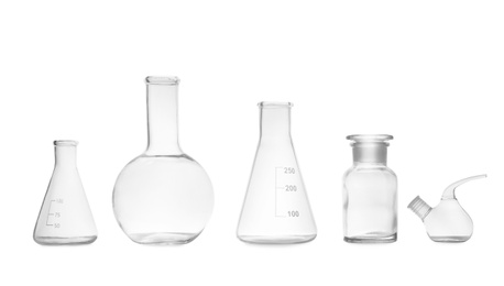 Photo of Set of empty laboratory glassware on white background