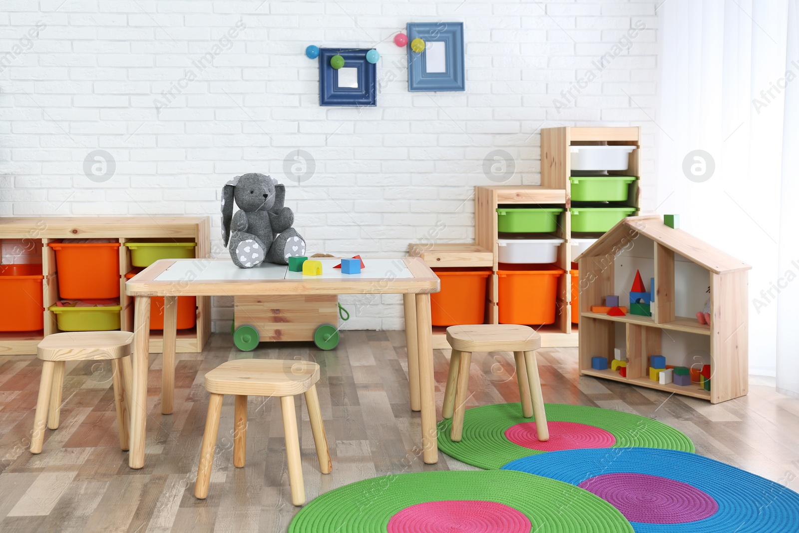 Photo of Modern child room interior with table and stools