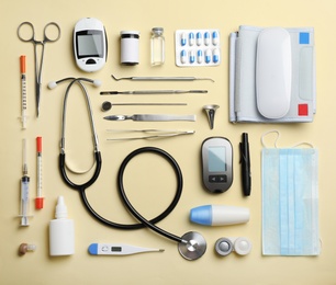 Photo of Flat lay composition with medical objects on color background