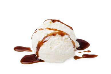 Photo of Scoop of ice cream with caramel sauce isolated on white