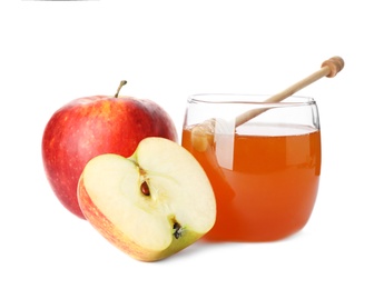 Photo of Glass jar with sweet honey and apples on white background