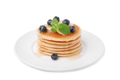Photo of Delicious pancakes with banana slices, blueberries and mint isolated on white