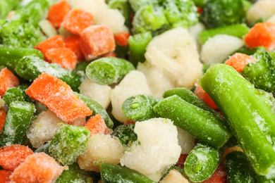 Photo of Different frozen vegetables as background, closeup view