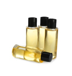 Photo of Mini bottles with cosmetic products on white background. Hotel amenities