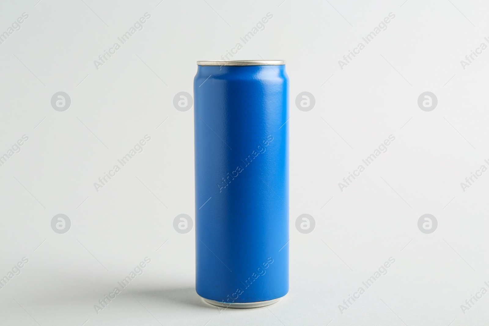 Photo of Energy drink in blue can on light grey background
