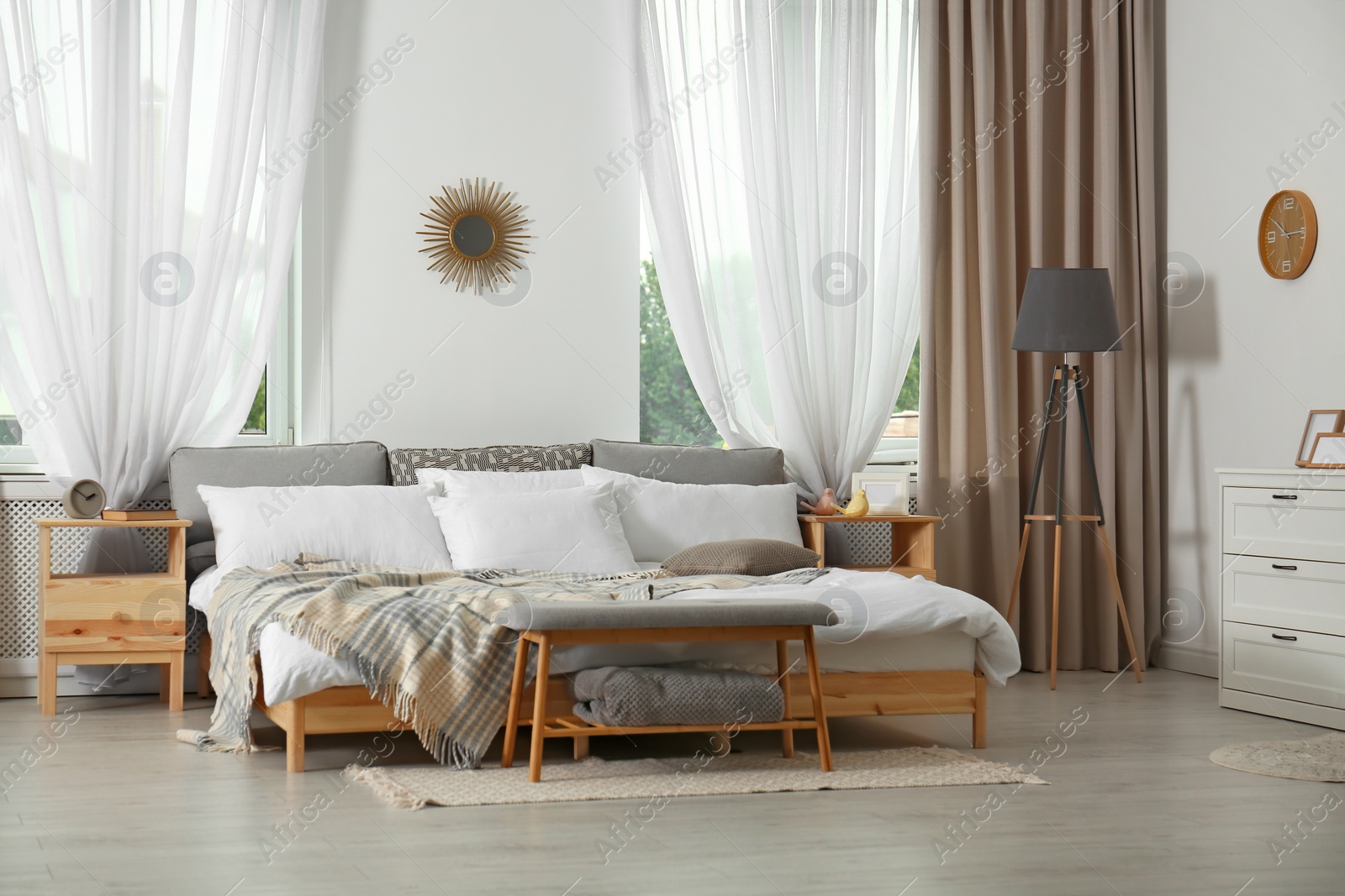 Stylish modern room interior with comfortable bed Photo of Stylish modern room interior with comfortable bed