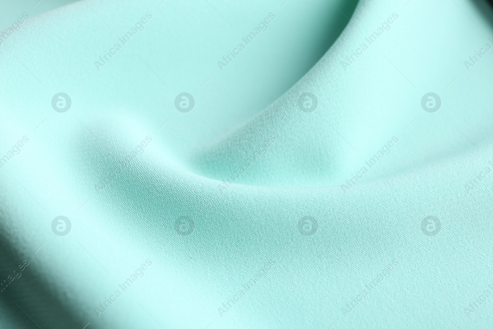 Photo of Texture of beautiful light blue fabric as background, closeup