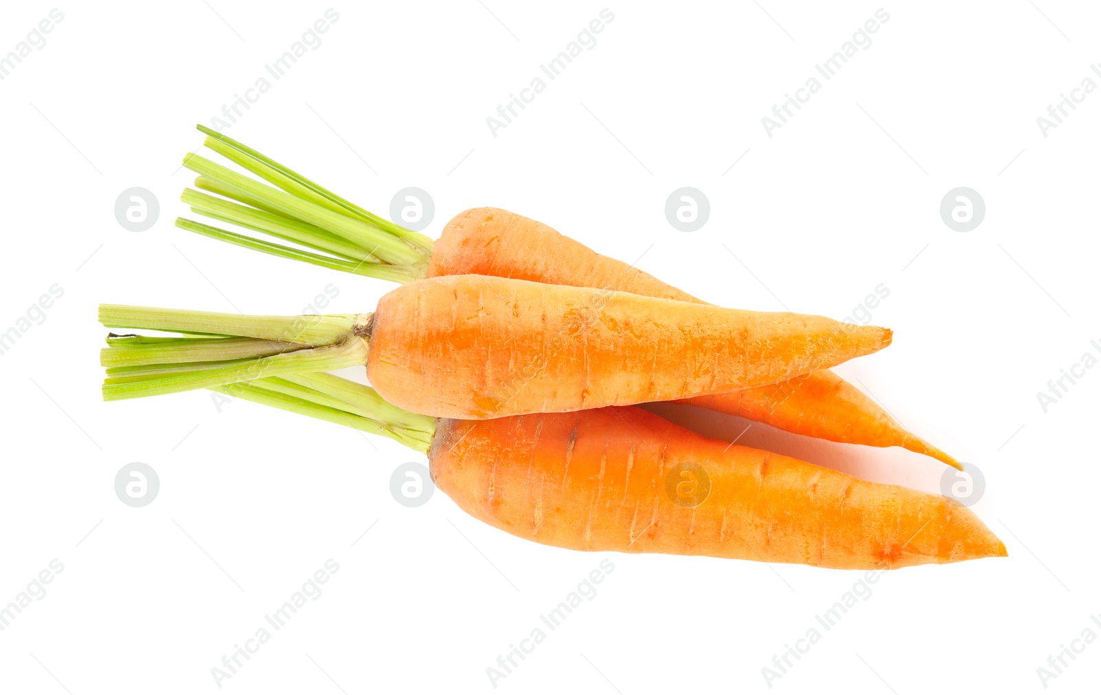 Photo of Pile of fresh ripe carrots isolated on white, top view