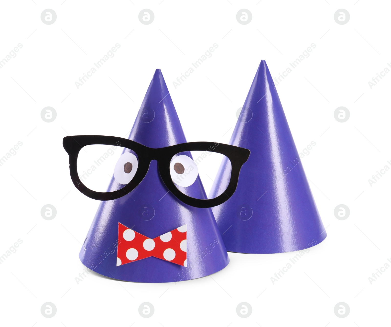 Photo of Handmade party hats with funny face isolated on white