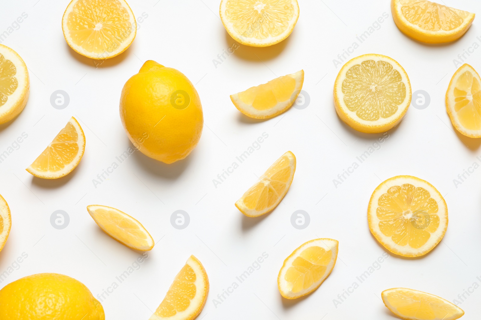 Photo of Fresh lemons on white background, top view. Citrus fruits