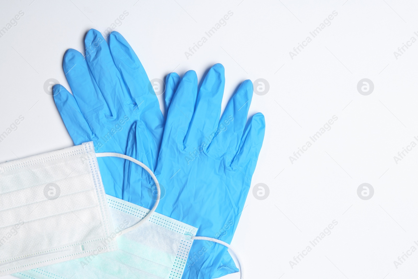 Photo of Flat lay composition with medical gloves on white background