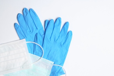 Flat lay composition with medical gloves on white background