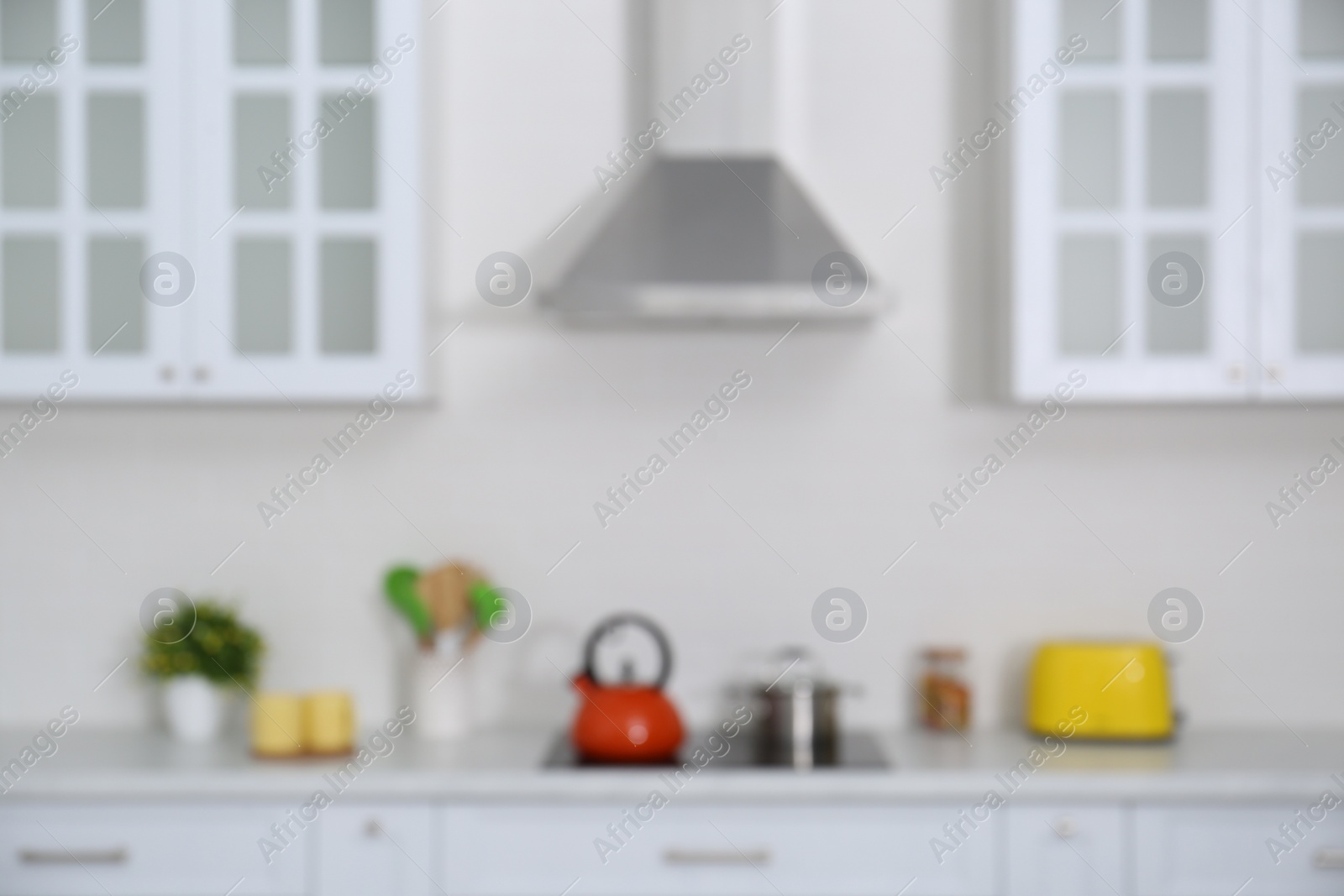 Photo of Blurred view of modern stylish kitchen interior