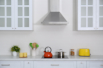 Photo of Blurred view of modern stylish kitchen interior