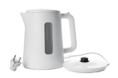 Photo of Modern electric kettle with base and plug isolated on white
