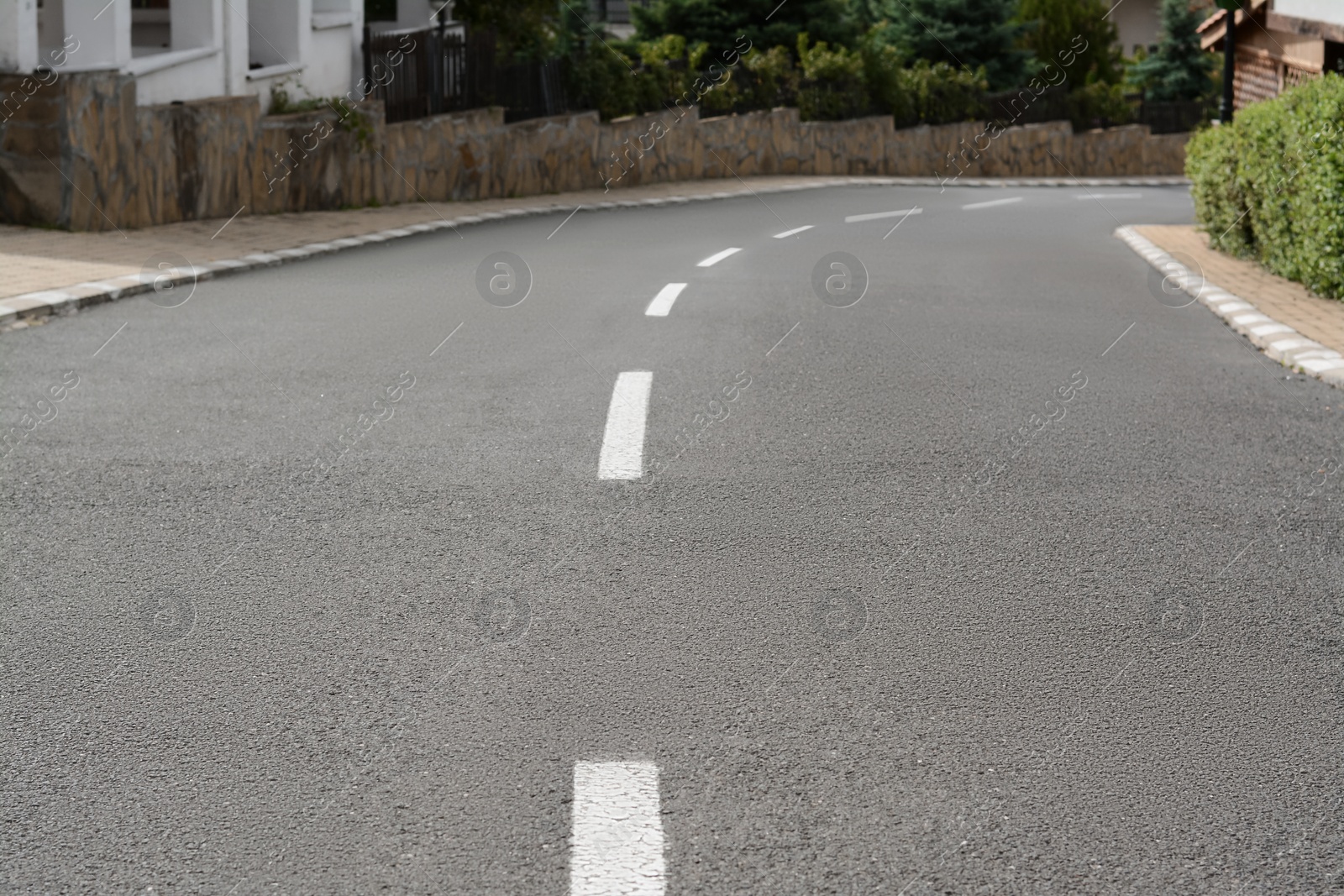 Photo of View of empty asphalt road on city street