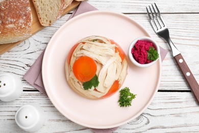 Photo of Delicious chicken aspic served on white wooden table, flat lay