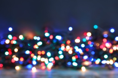 Blurred view of Christmas lights on table