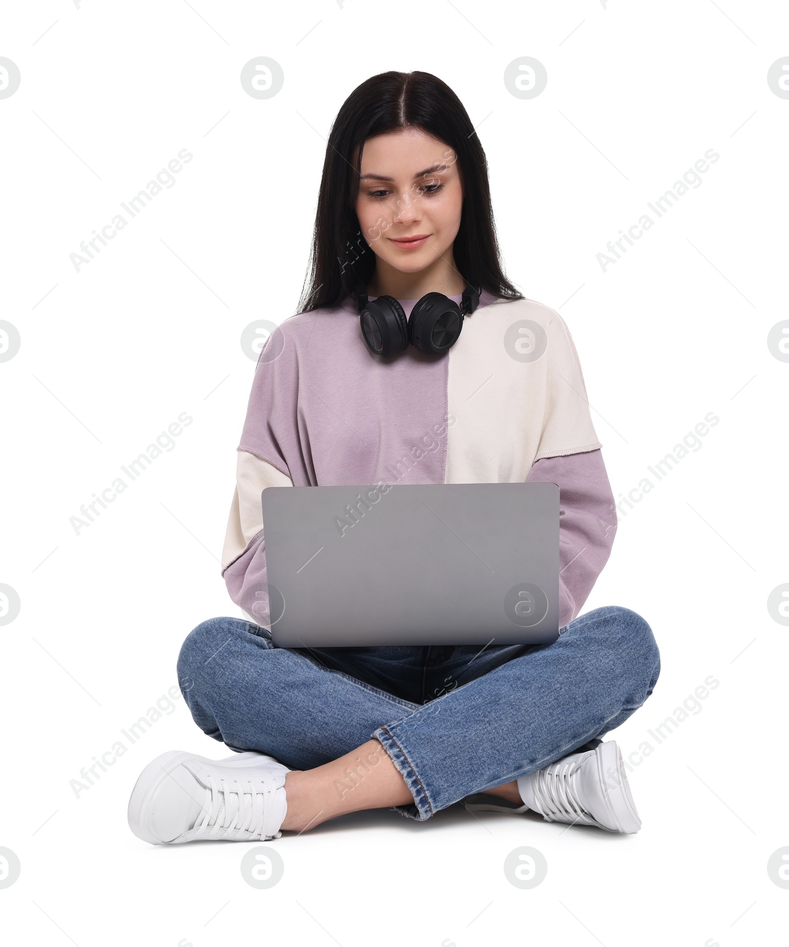 Photo of Student with laptop sitting on white background