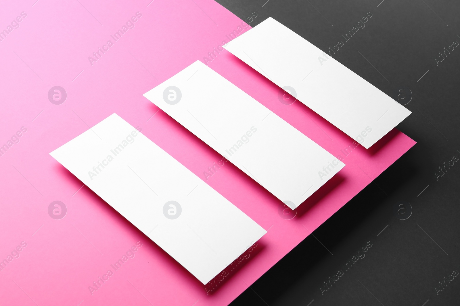 Photo of Empty sheets on color background. Mockup for design