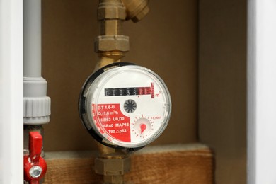 Electric meter in fuse box, space for text. Water measuring device