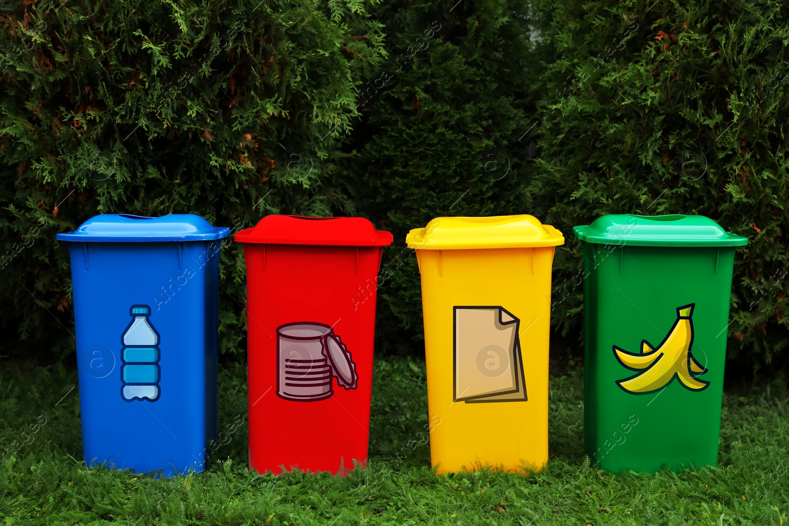 Image of Waste sorting. Recycling bins with illustrations of different garbage types outdoors